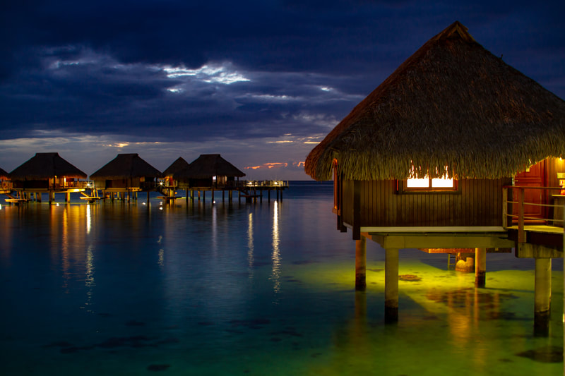 Overwater bungalows at night